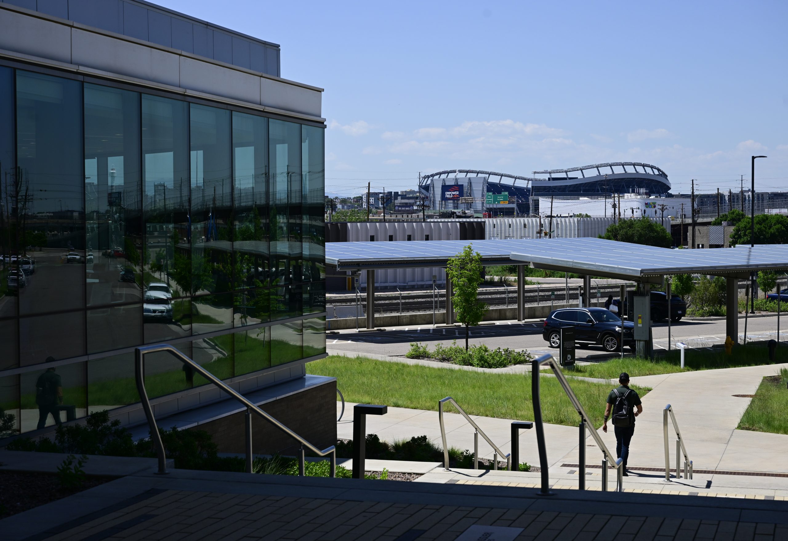 A person walks out of the Denver Water headquarters building,...